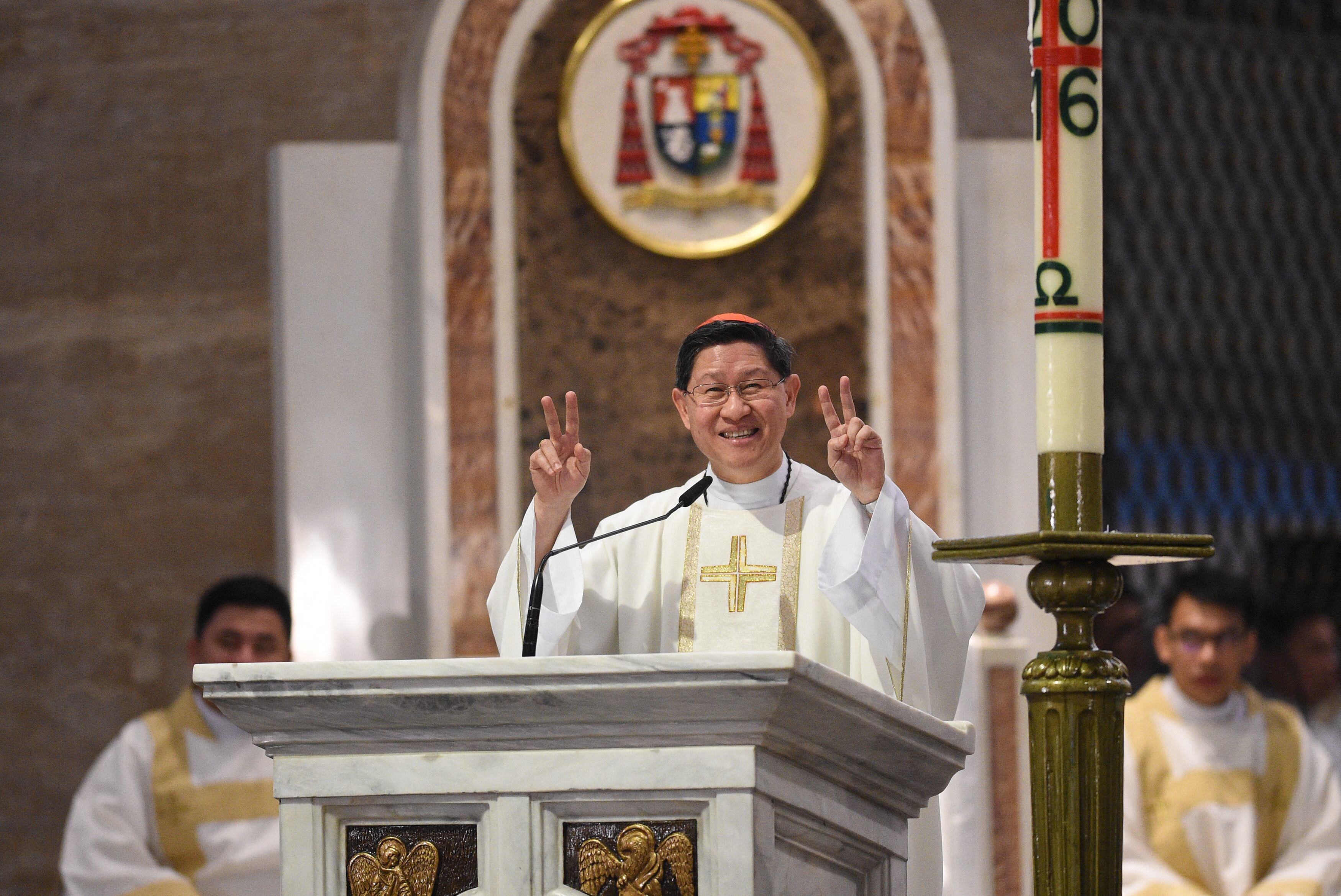 Philippine Roman Catholic Cardinal Luis Tagle delivers his homily at the signing of covenant for a clean election, during a ceremony inside the Manila cathedral on May 2, 2016. Philippine Catholic church leaders urged 80 million Catholics to reject presidential candidates who take "morally reprehensible" positions and whose speech and demeanour are opposed to the teachings of the church. (Photo by TED ALJIBE / AFP)