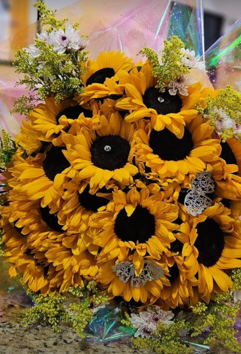 Este era el ramo de girasoles que don Nelson Hoffmann le iba a dar a Natalia Rodríguez en su despedida.