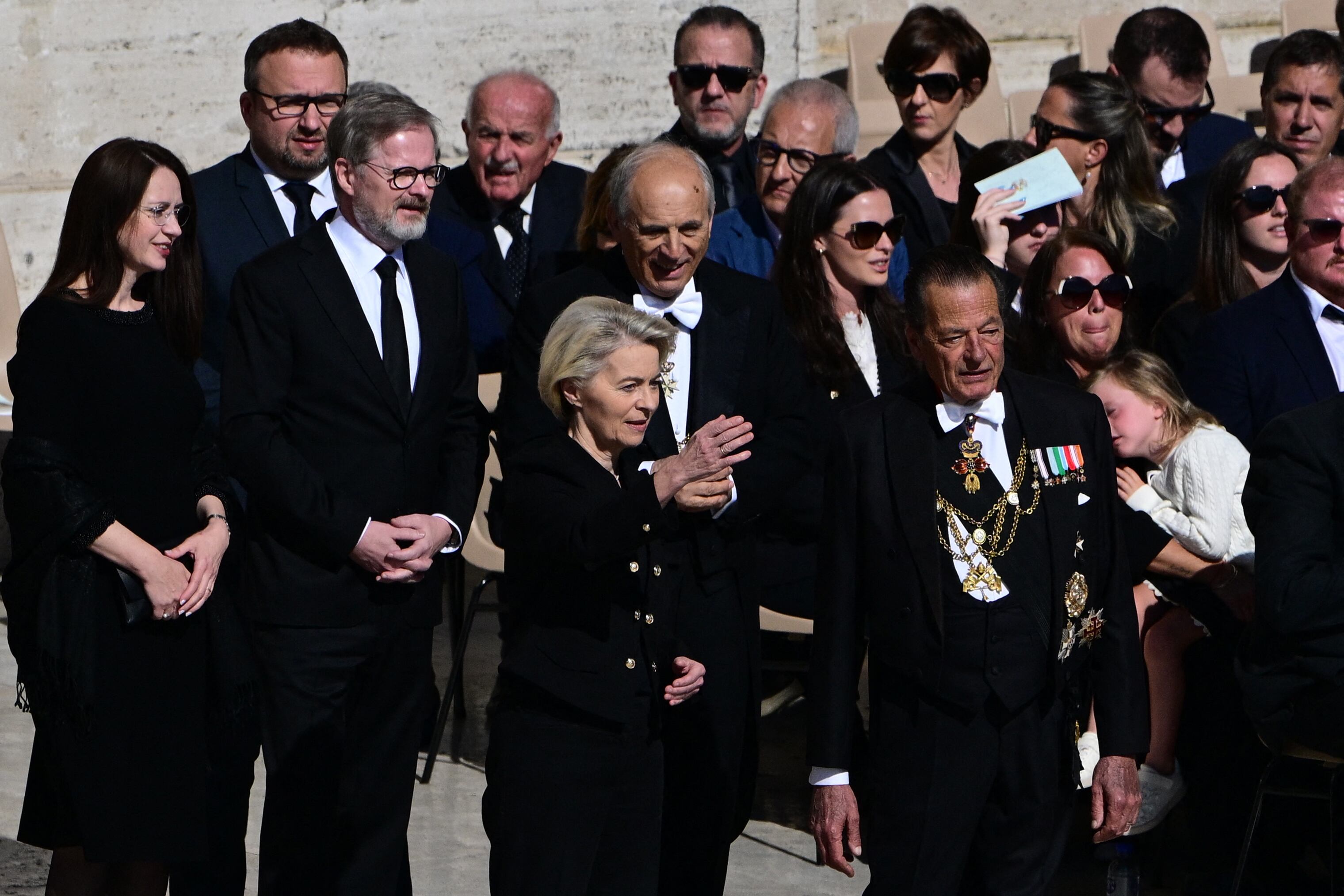 Argentina's President Javier Milei (R) stands with his sister General Secretary of the Presidency of Argentina, Karina Milei (2L) and Italy's President Sergio Mattarella (L) as they arrive ahead of the late Pope Francis' funeral ceremony at St Peter's Square at The Vatican on April 26, 2025. (Photo by Filippo MONTEFORTE / AFP)