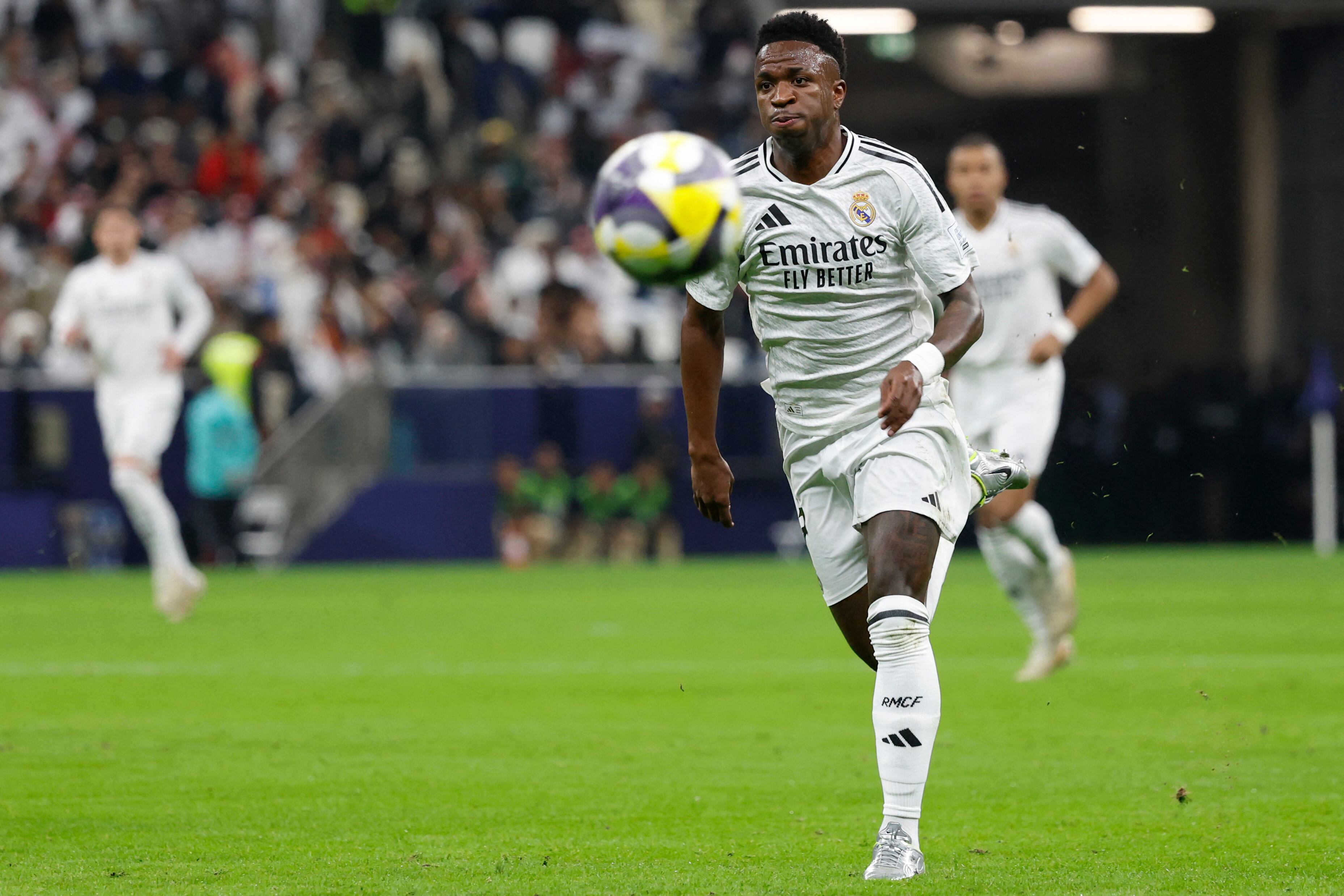 Real Madrid's Brazilian forward #7 Vinicius Junior runs after the ball during the 2024 FIFA Intercontinental Cup final football match between Spain's Real Madrid and Mexico's Pachuca at the Lusail Stadium in Doha on December 18, 2024. (Photo by KARIM JAAFAR / AFP)