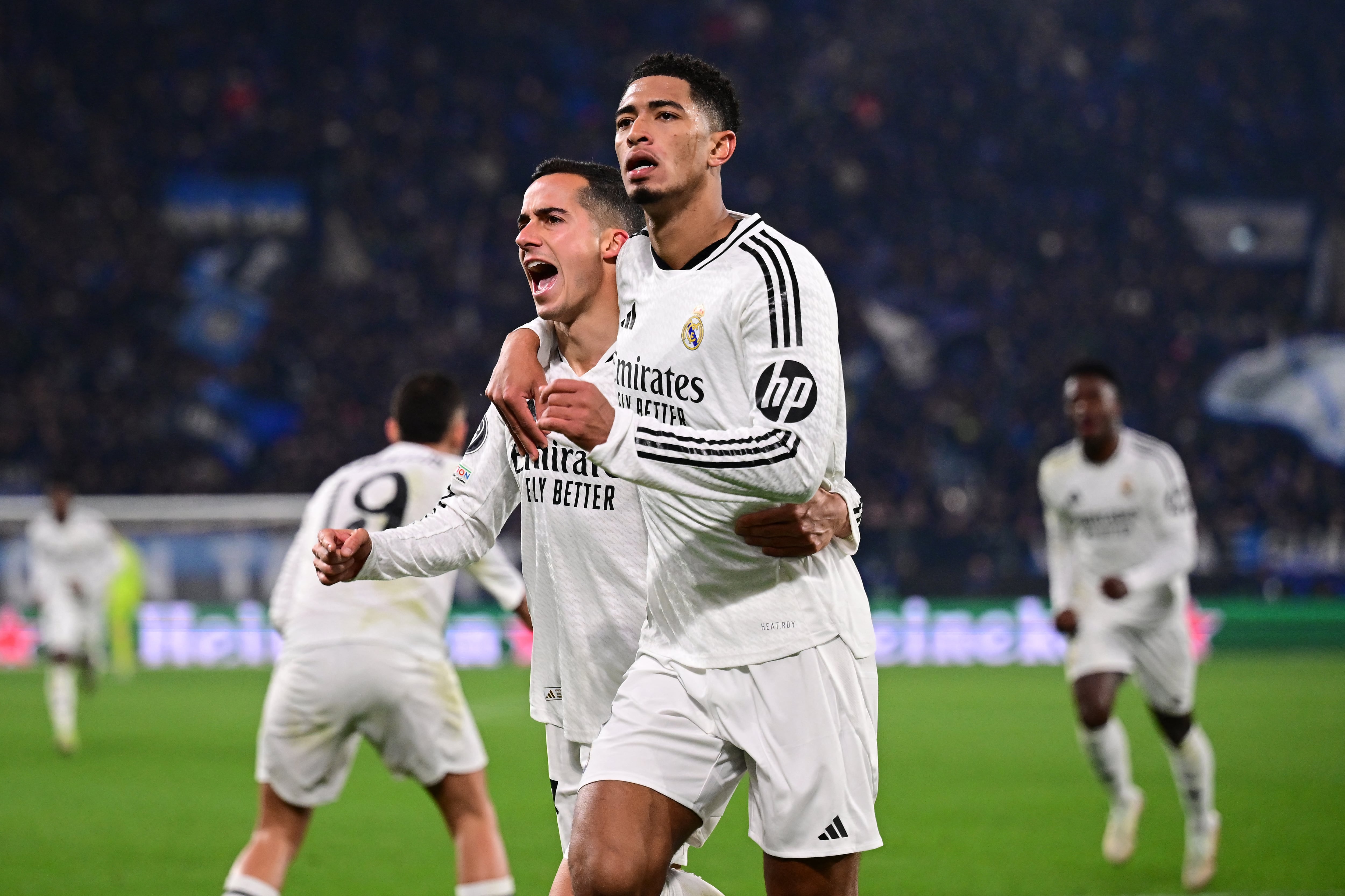 Real Madrid's English midfielder #05 Jude Bellingham celebrates scoring his team's third goal during the UEFA Champions League football match between Atalanta and Real Madrid at the Gewiss Stadium in Bergamo, on December 10, 2024. (Photo by Marco BERTORELLO / AFP)