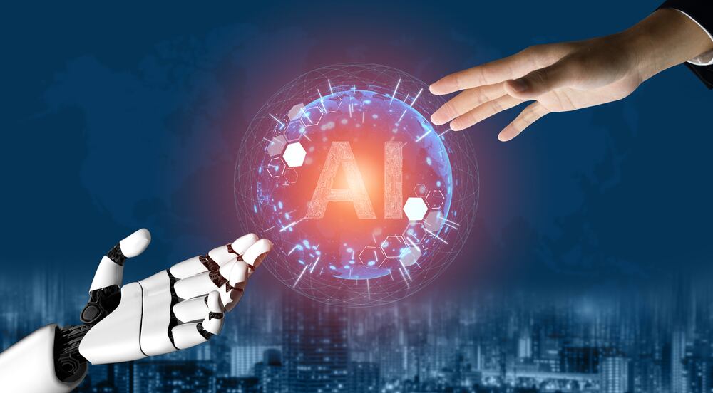 Un robot dando la mano a un humano por medio de la inteligencia artificial