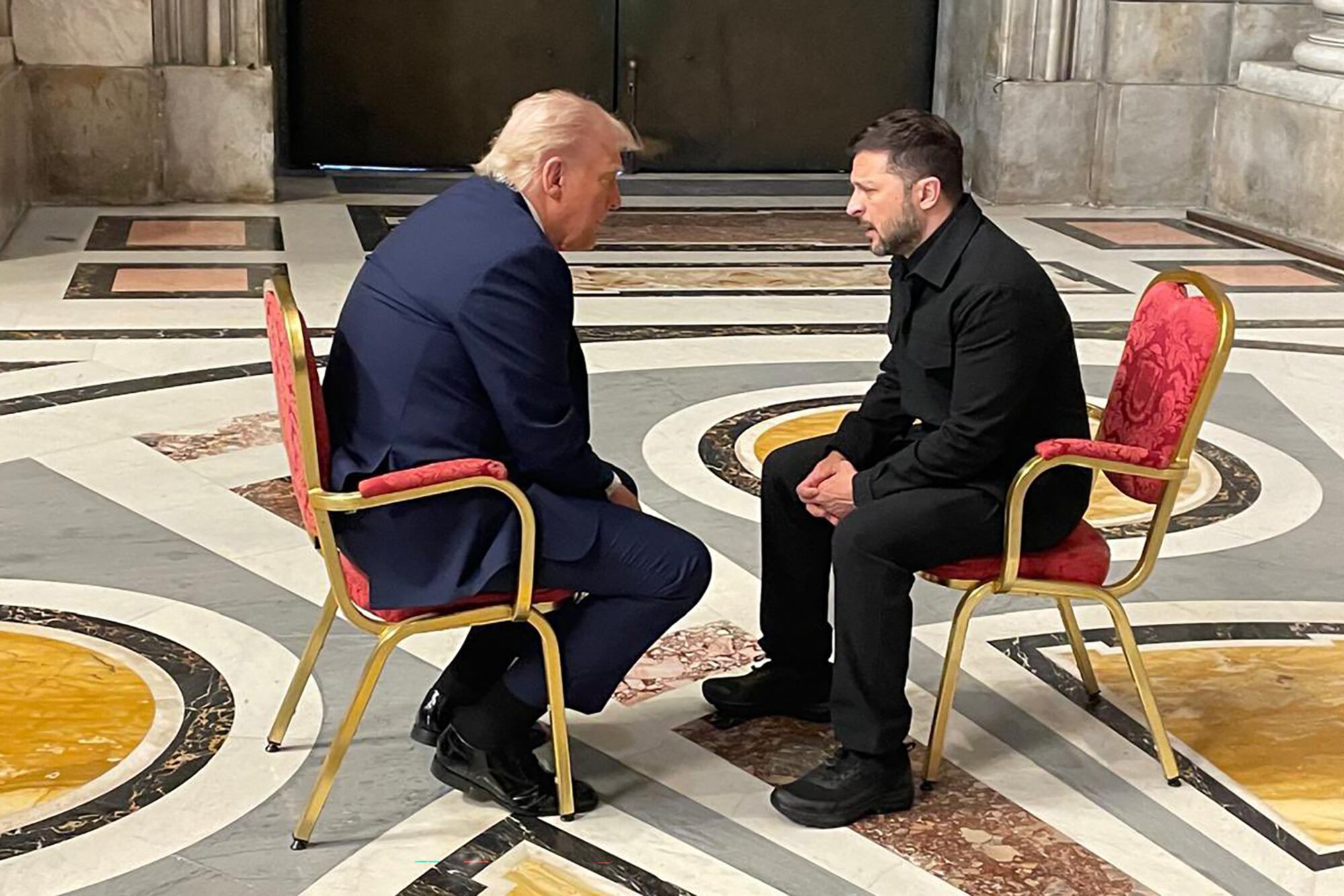 In this handout photograph taken and released by the Ukrainian Foreign Ministry on April 26, 2025, Ukraine's President Volodymyr Zelensky (R) meets with US President Donald Trump (L) on the sidelines of Pope Francis's funeral at St. Peter's Basilica at The Vatican. (Photo by Handout / UKRAINIAN FOREIGN MINISTRY / AFP) / RESTRICTED TO EDITORIAL USE - MANDATORY CREDIT "AFP PHOTO / UKRAINIAN FOREIGN MINISTRY" - NO MARKETING NO ADVERTISING CAMPAIGNS - DISTRIBUTED AS A SERVICE TO CLIENTS