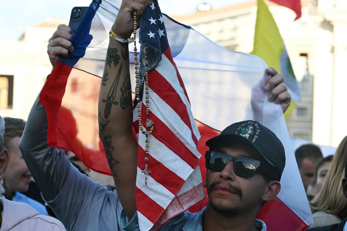 Newly elected Pope Leo XIV, Robert Prevost addresses the crowd from the main central loggia balcony of the St Peter's Basilica for the first time, after the cardinals ended the conclave, in The Vatican, on May 8, 2025. Robert Francis Prevost was on Thursday elected the first pope from the United States, the Vatican announced. A moderate who was close to Pope Francis and spent years as a missionary in Peru, he becomes the Catholic Church's 267th pontiff, taking the papal name Leo XIV. (Photo by Tiziana FABI / AFP)