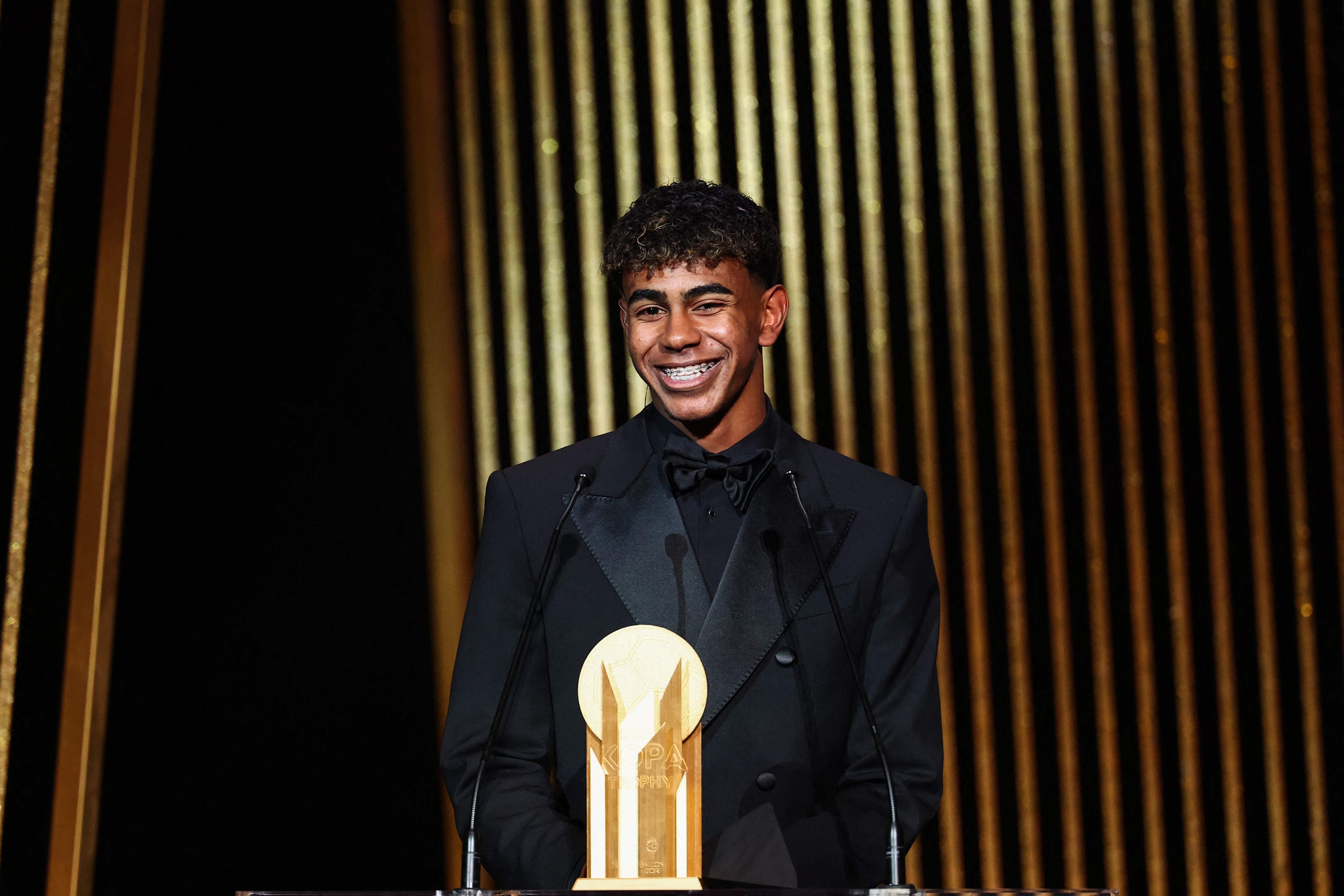 Barcelona's Spanish forward Lamine Yamal receives the Kopa Trophy for best under-21 player during the 2024 Ballon d'Or France Football award ceremony at the Theatre du Chatelet in Paris on October 28, 2024. (Photo by FRANCK FIFE / AFP)
