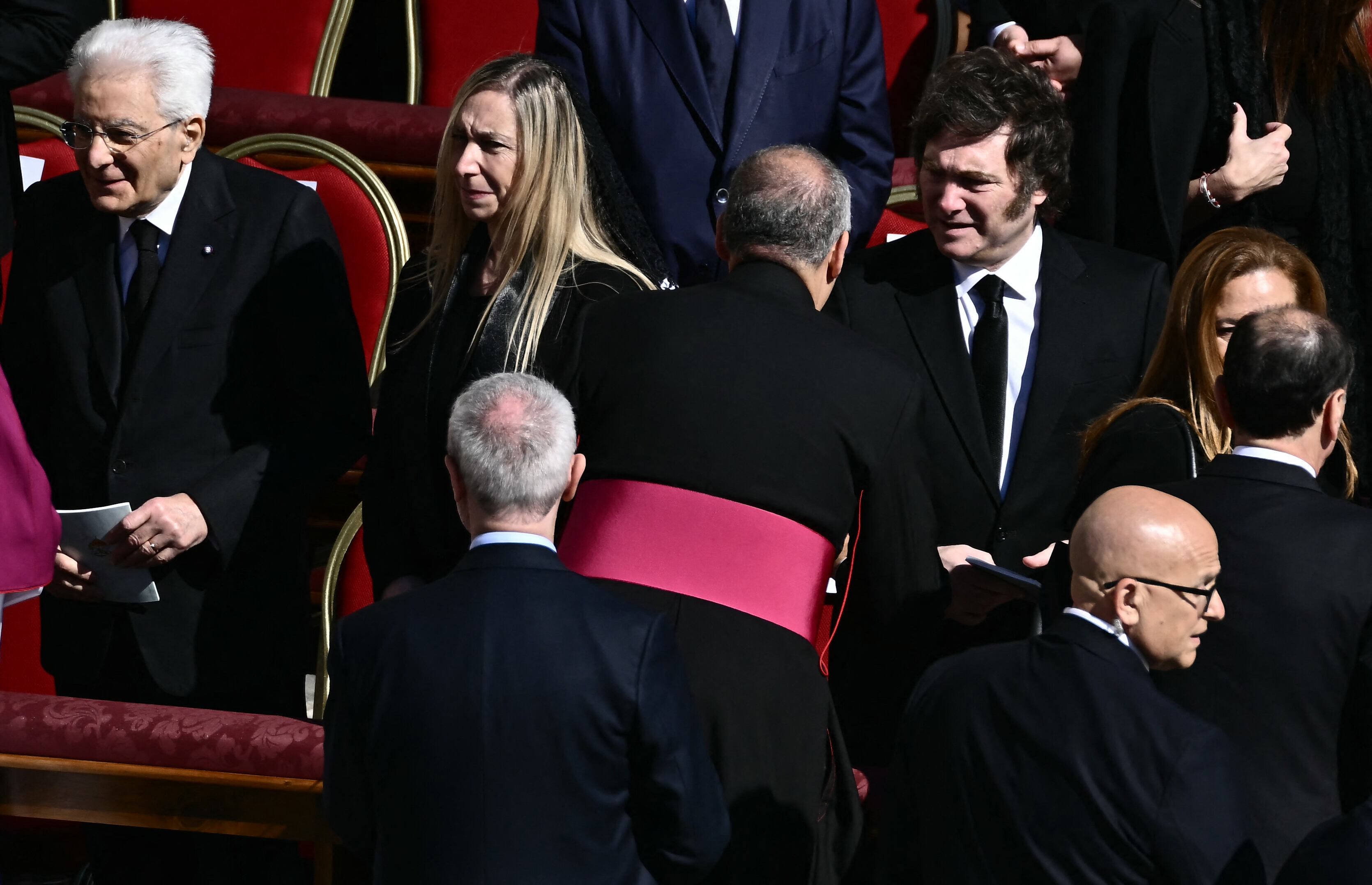 Argentina's President Javier Milei (R) stands with his sister General Secretary of the Presidency of Argentina, Karina Milei (2L) and Italy's President Sergio Mattarella (L) as they arrive ahead of the late Pope Francis' funeral ceremony at St Peter's Square at The Vatican on April 26, 2025. (Photo by Filippo MONTEFORTE / AFP)