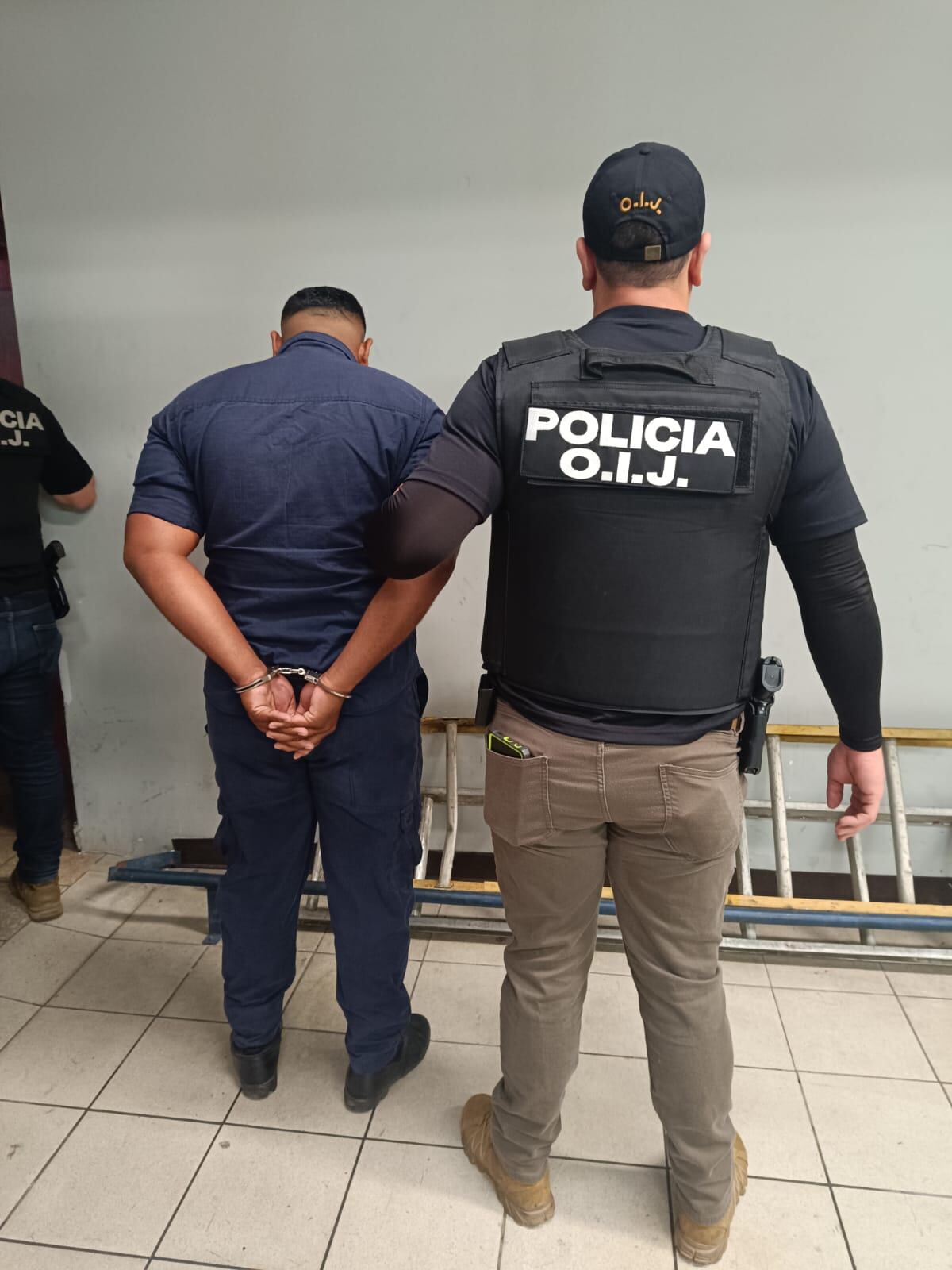 Policías detenidos por homicidio en celda en delegación de Pavas. Foto OIJ.