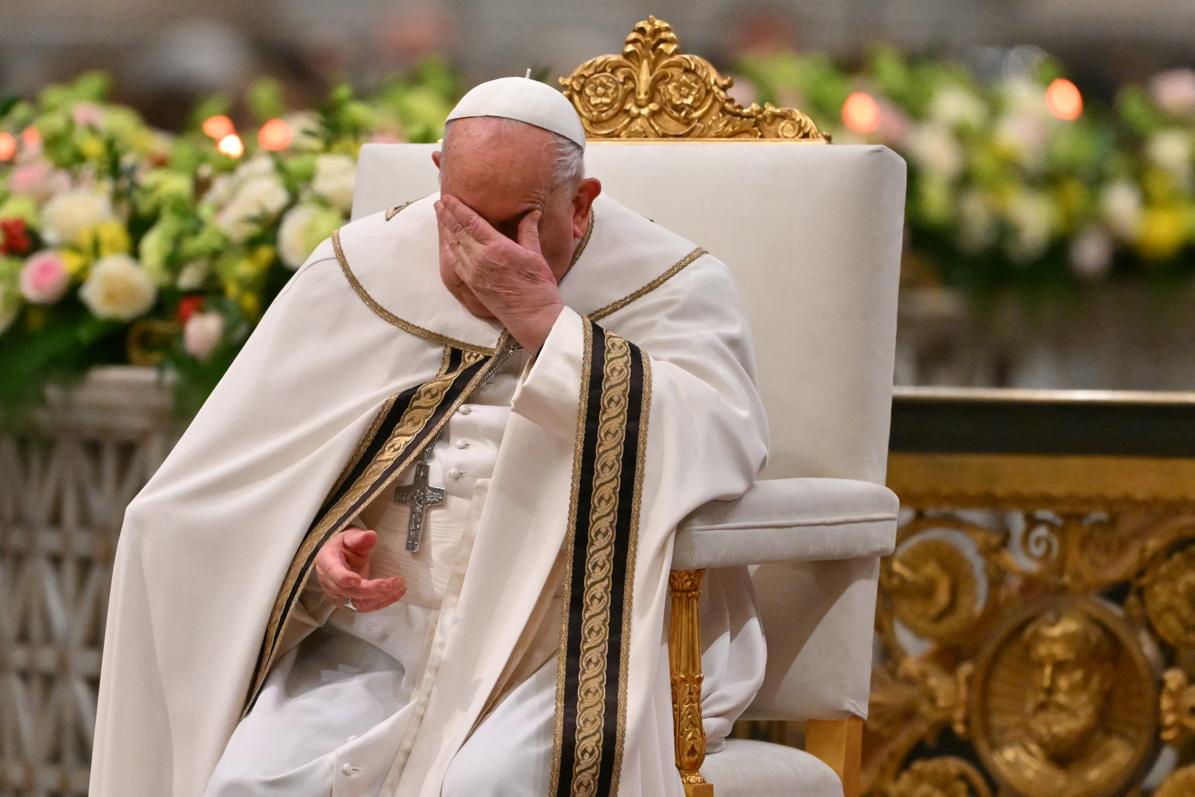 Pope Francis gestures during the vespers at Saint Paul Outside the Walls, in Rome on January 25, 2025. Pope Francis was admitted to hospital in Rome on February 14, 2025 for tests and treatment for ongoing bronchitis, the Vatican announced. (Photo by Andreas SOLARO / AFP)