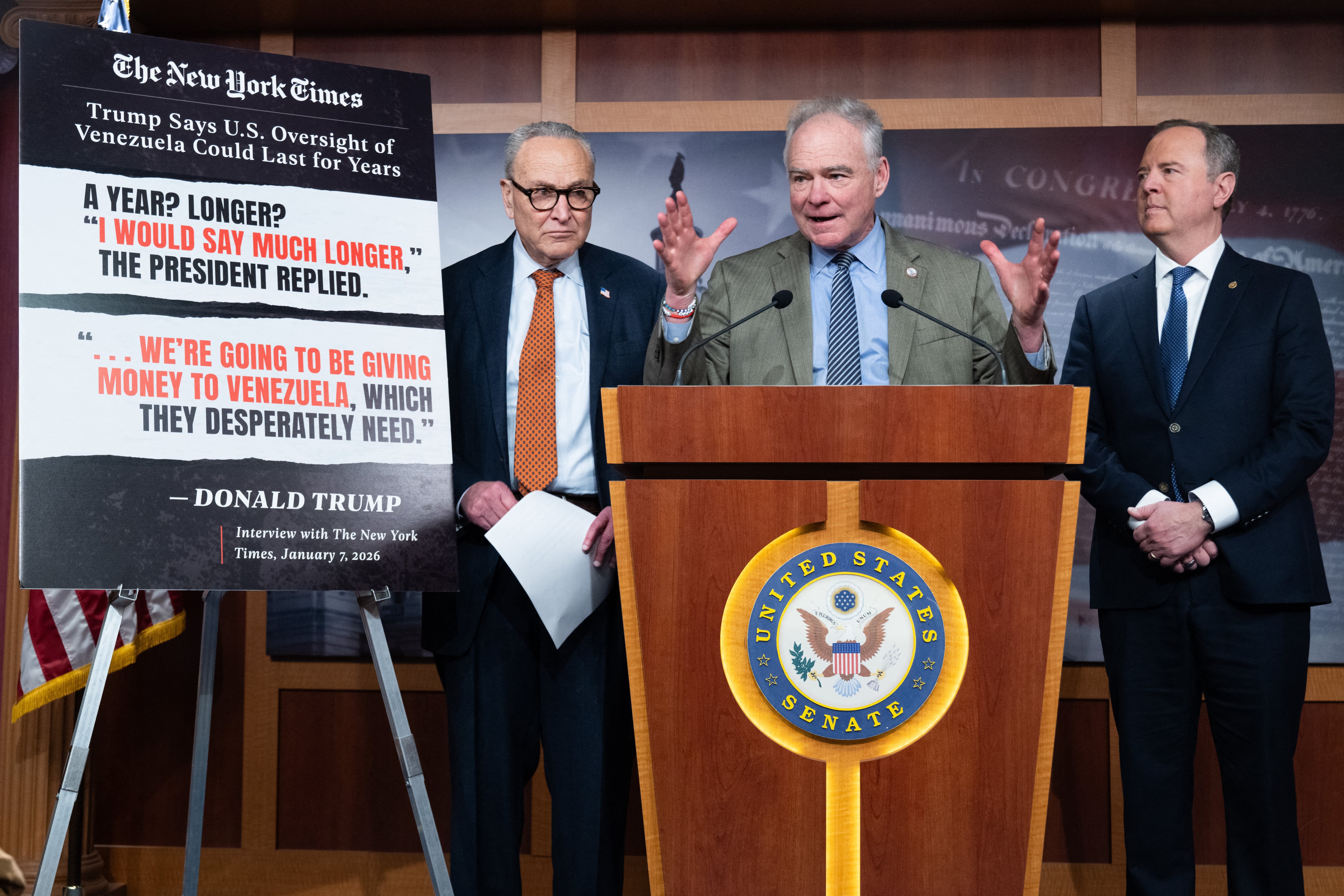 US Senator Tim Kaine (C), Democrat of Virginia, speaks alongside US Senate Minority Leader Chuck Schumer (L), Democrat of New York, and US Senator Adam Schiff (R), Democrat of California, during a press conference after a US Senate vote on a War Powers Resolution blocking further US military action in Venezuela at the US Capitol in Washington, DC, January 8, 2026. The US Senate took a major step Thursday toward passing a resolution to rein in President Donald Trump's military actions in Venezuela -- a rare bipartisan rebuke following alarm over the secretive capture of leader Nicolas Maduro. The Democratic-led legislation, which bars further US hostilities against Venezuela without explicit congressional authorization, got through a key procedural vote with support from five Republicans. (Photo by SAUL LOEB / AFP)