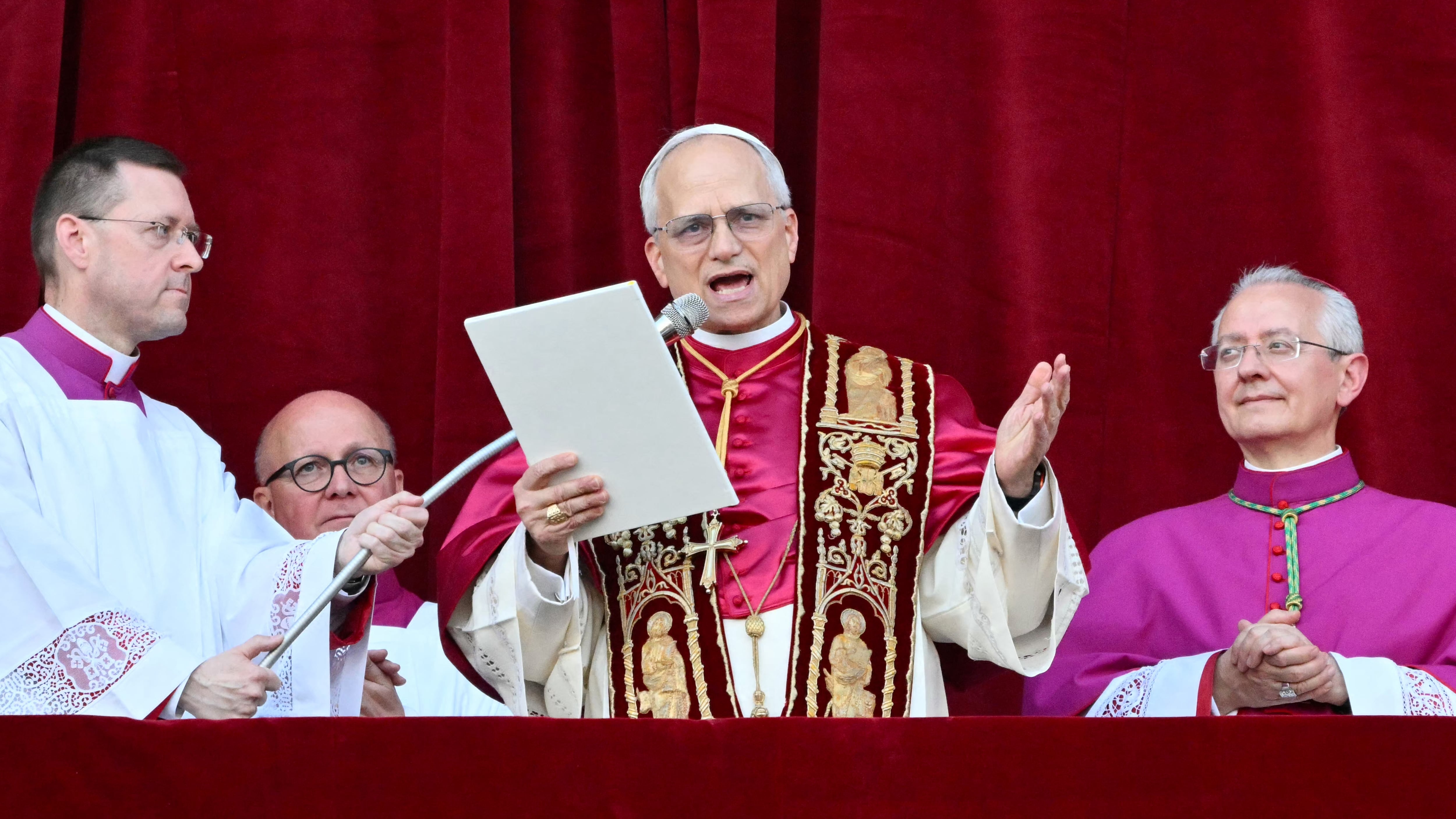 Newly elected Pope Leo XIV, Robert Prevost addresses the crowd from the main central loggia balcony of the St Peter's Basilica for the first time, after the cardinals ended the conclave, in The Vatican, on May 8, 2025. Robert Francis Prevost was on Thursday elected the first pope from the United States, the Vatican announced. A moderate who was close to Pope Francis and spent years as a missionary in Peru, he becomes the Catholic Church's 267th pontiff, taking the papal name Leo XIV. (Photo by Alberto PIZZOLI / AFP)